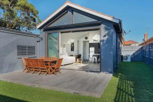 Modest exterior expansive interior Maroubra addition - courtyard looking in to living area